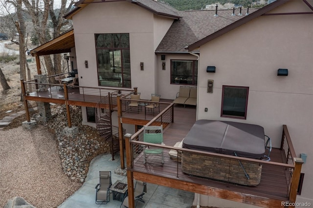 1100 Pinon Dr, Poncha Springs, CO 81242 - rear view of house with a shingled roof, a wooden deck, and stucco siding