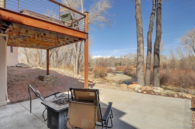 1100 Pinon Dr, Poncha Springs, CO 81242 - view of patio with an outdoor fire pit and a deck