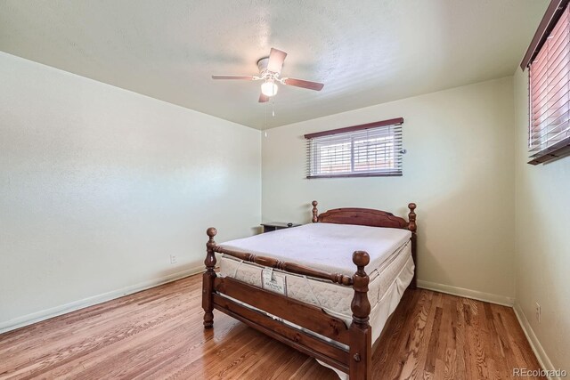 bedroom featuring ceiling fan and light wood-type flooring