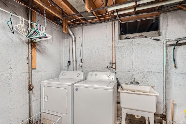 laundry area featuring washer and clothes dryer and sink
