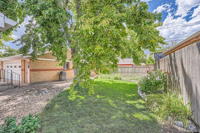 view of yard featuring a garage