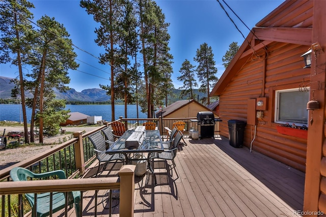 deck featuring a grill and a water and mountain view