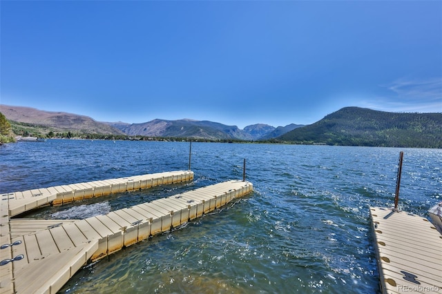 dock area with a water and mountain view