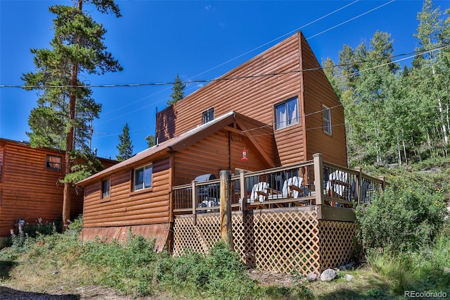 rear view of house with a deck