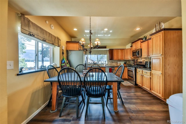 dining area featuring a chandelier and dark hardwood / wood-style floors