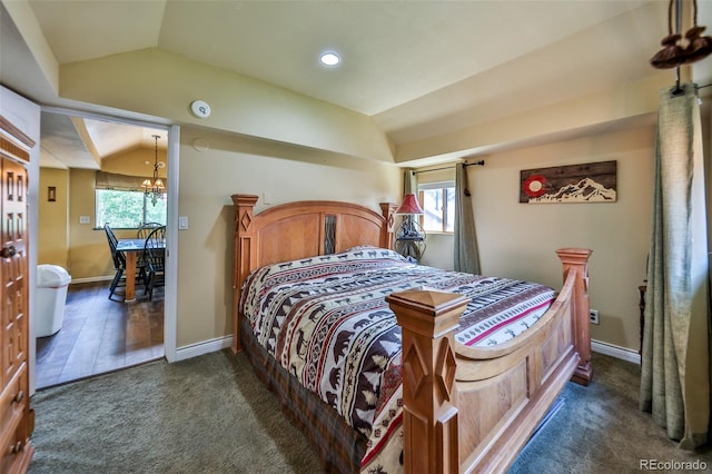 carpeted bedroom with a chandelier, multiple windows, and lofted ceiling