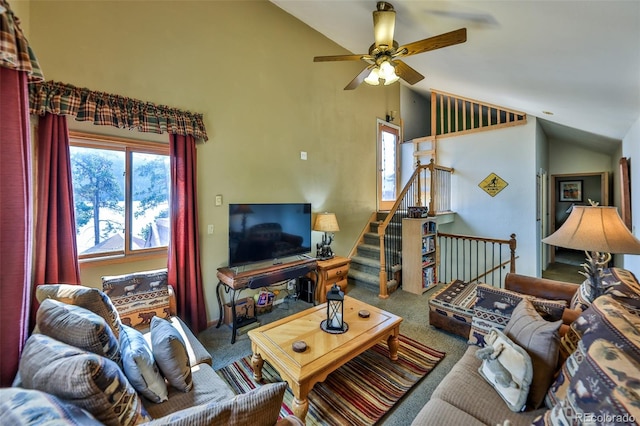 living room with carpet flooring, ceiling fan, and lofted ceiling