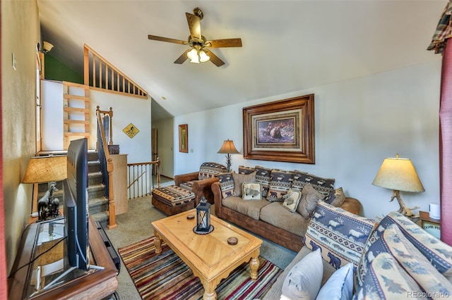 carpeted living room featuring ceiling fan and high vaulted ceiling