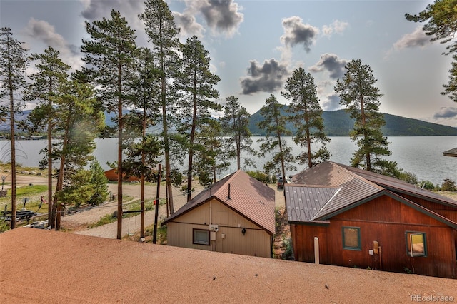 exterior space featuring a water and mountain view