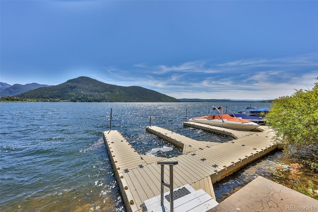 dock area featuring a water and mountain view