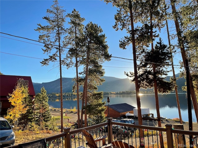 exterior space with a water and mountain view