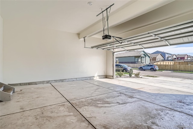 garage featuring a garage door opener