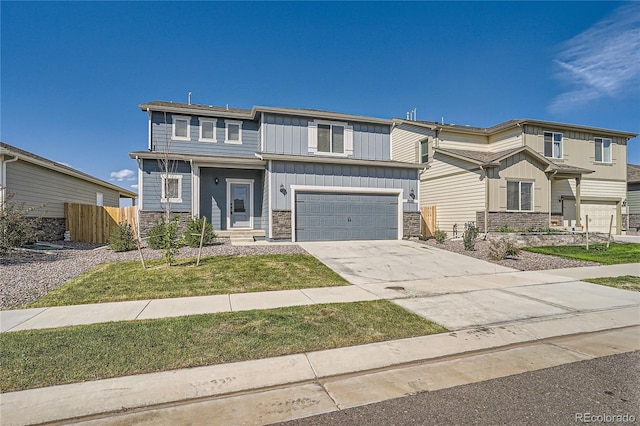 view of front of home with a garage and a front yard