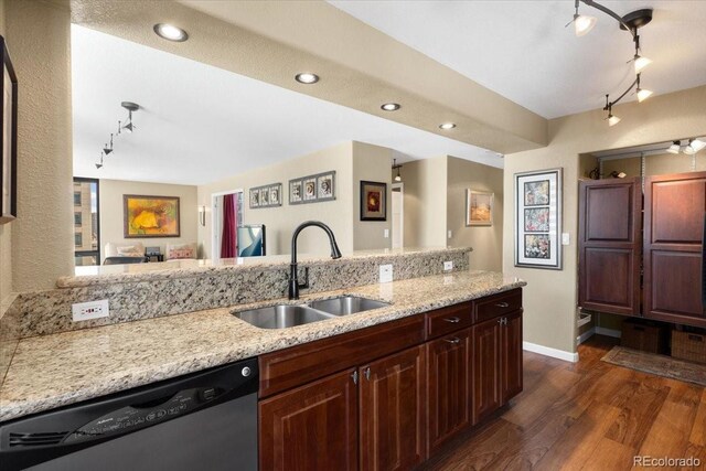1625 Larimer St Unit 1605, Denver, CO 80202 - kitchen featuring track lighting, dishwasher, dark wood-type flooring, light stone countertops, and recessed lighting