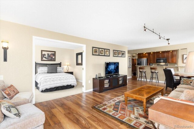 1625 Larimer St Unit 1605, Denver, CO 80202 - living room featuring track lighting and dark wood-style floors
