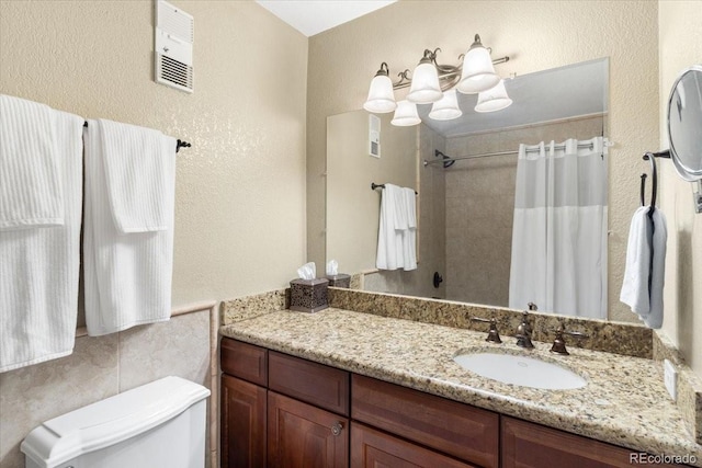 1625 Larimer St Unit 1605, Denver, CO 80202 - full bath with vanity, curtained shower, and a textured wall