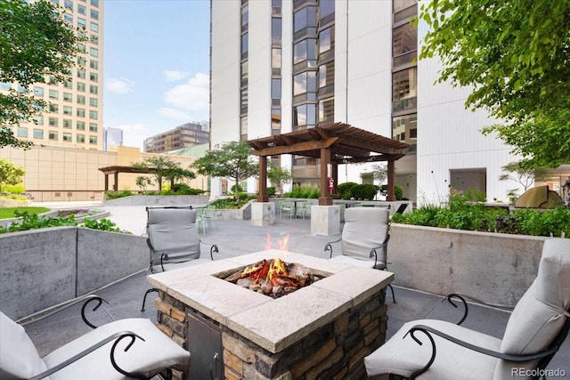 1625 Larimer St Unit 1605, Denver, CO 80202 - view of patio featuring a fire pit, a pergola, and a city view