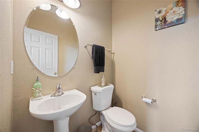 13078 Monaco Way, Thornton, CO 80602 - half bathroom featuring toilet and a sink