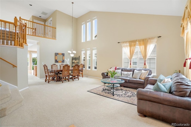 13078 Monaco Way, Thornton, CO 80602 - living room featuring carpet floors, stairway, healthy amount of natural light, high vaulted ceiling, and a chandelier