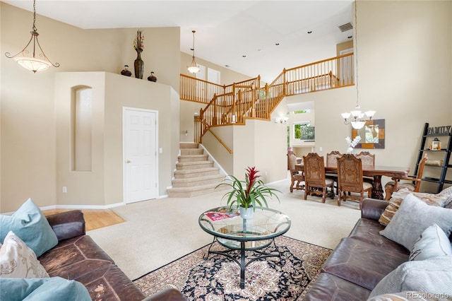 13078 Monaco Way, Thornton, CO 80602 - living area with carpet, high vaulted ceiling, stairs, baseboards, and a chandelier