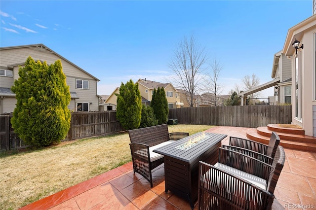 13078 Monaco Way, Thornton, CO 80602 - view of patio featuring an outdoor fire pit and a residential view