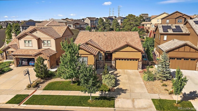 23871 E Ontario Pl, Aurora, CO 80016 - view of front of home with a residential view, driveway, and a tiled roof
