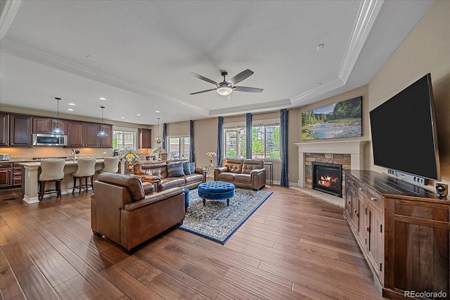 23871 E Ontario Pl, Aurora, CO 80016 - living room with a raised ceiling, dark wood-type flooring, plenty of natural light, ceiling fan, and recessed lighting