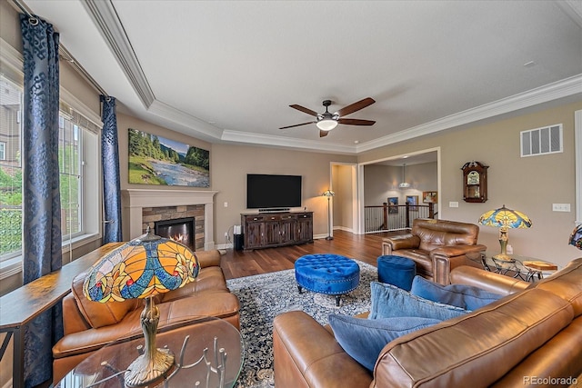 23871 E Ontario Pl, Aurora, CO 80016 - living room with wood finished floors, ceiling fan, ornamental molding, and a fireplace