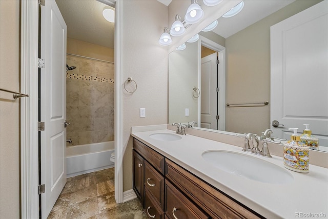23871 E Ontario Pl, Aurora, CO 80016 - bathroom with double vanity,  shower combination, and stone finish flooring