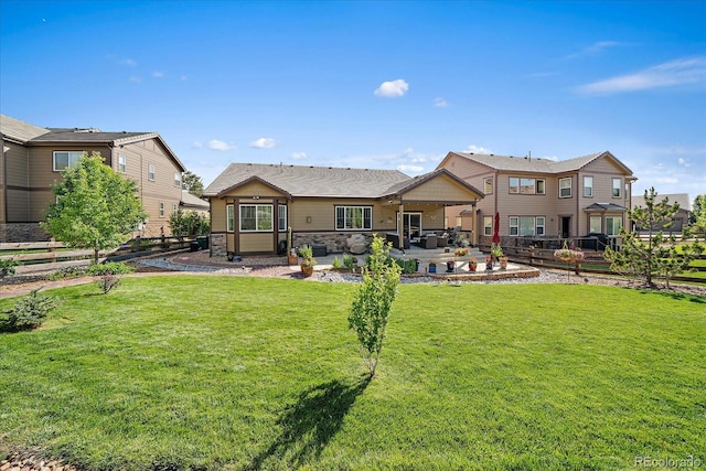 23871 E Ontario Pl, Aurora, CO 80016 - back of property with a patio area, stone siding, and outdoor lounge area