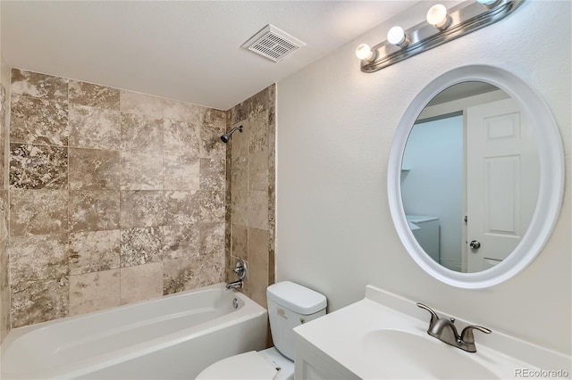 full bathroom with vanity, toilet, and tiled shower / bath