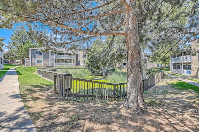 view of yard with a balcony