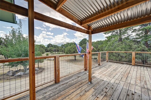 wooden terrace featuring a mountain view