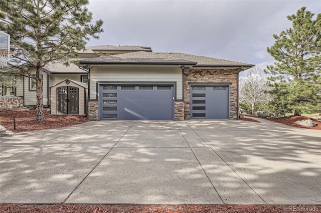 4586 Carefree Trl, Parker, CO 80134 - view of front of home featuring stone siding, an attached garage, driveway, and a shingled roof