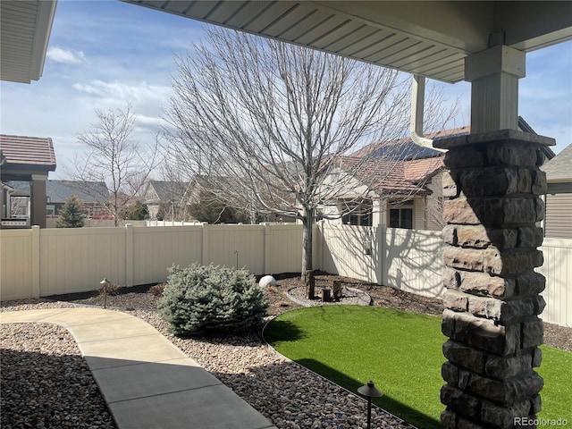 view of yard with a fenced backyard