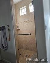 full bathroom with a stall shower