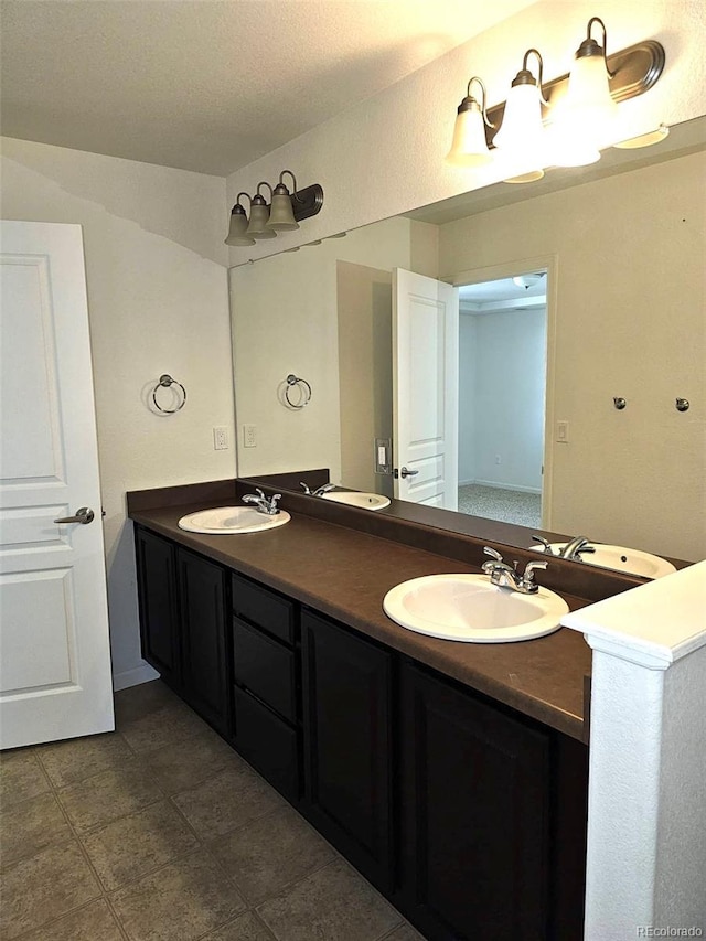 bathroom with a sink and double vanity