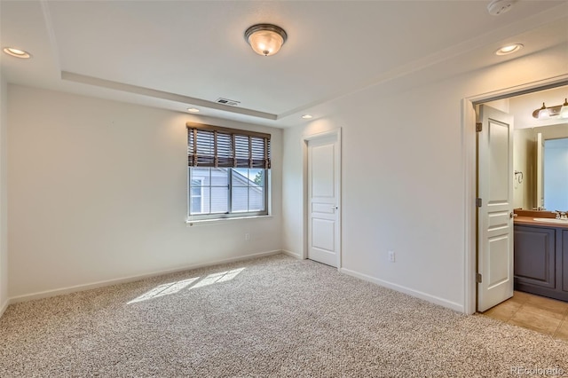 19753 E 54th Ave, Denver, CO 80249 - unfurnished bedroom featuring light colored carpet, recessed lighting, and connected bathroom