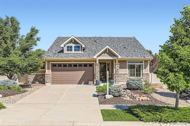 19753 E 54th Ave, Denver, CO 80249 - craftsman-style home with stone siding, concrete driveway, and a garage