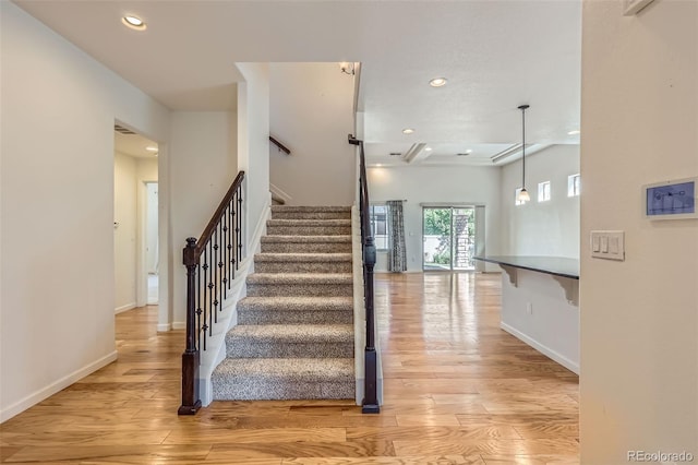 19753 E 54th Ave, Denver, CO 80249 - stairway featuring recessed lighting and wood finished floors