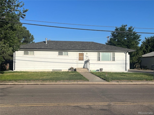 single story home featuring a front yard