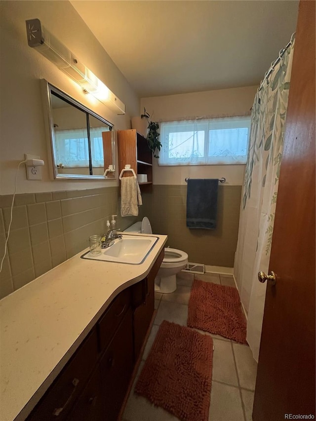 bathroom featuring tile patterned flooring, vanity, backsplash, and toilet