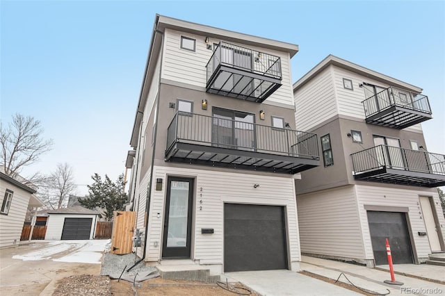 view of front facade featuring a balcony and a garage