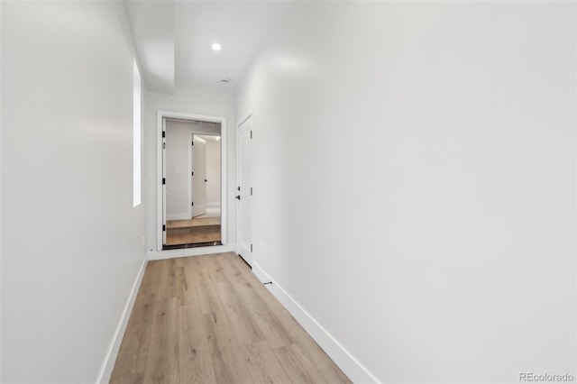 hall with light hardwood / wood-style floors