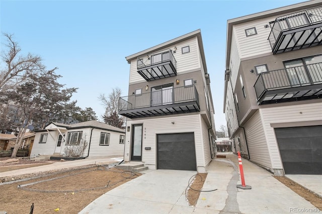 view of front facade with a balcony and a garage