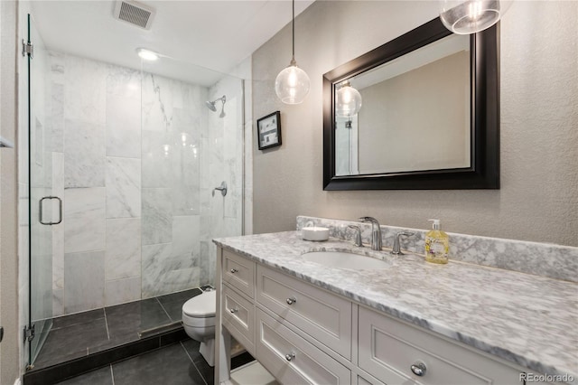 bathroom featuring visible vents, toilet, a shower stall, vanity, and tile patterned flooring