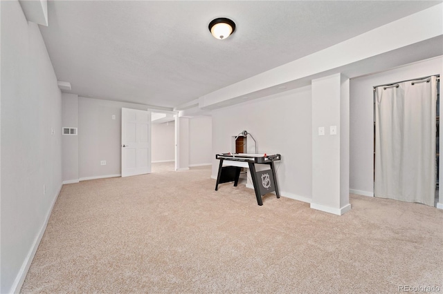 playroom with carpet, visible vents, and baseboards