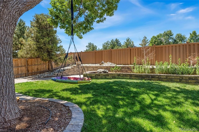 view of yard with a fenced backyard