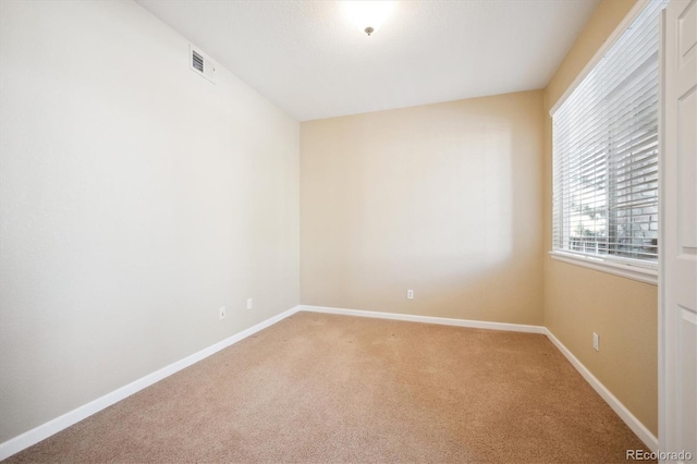 empty room featuring carpet flooring