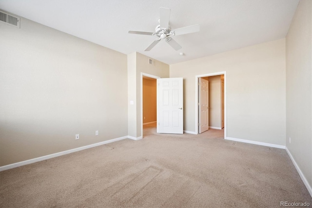 empty room with light carpet and ceiling fan